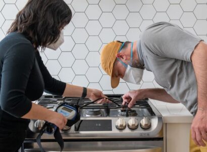 Image of PSE scientists sampling a gas stove