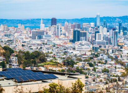 Image of the San Francisco skyline with a solar home in the foreground.