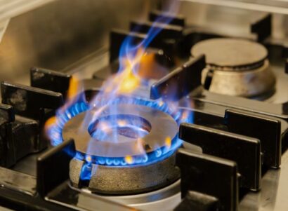 Image of a lit gas burner of a stove.