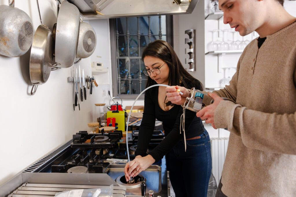 Scientist collecting samples from a gas stove 