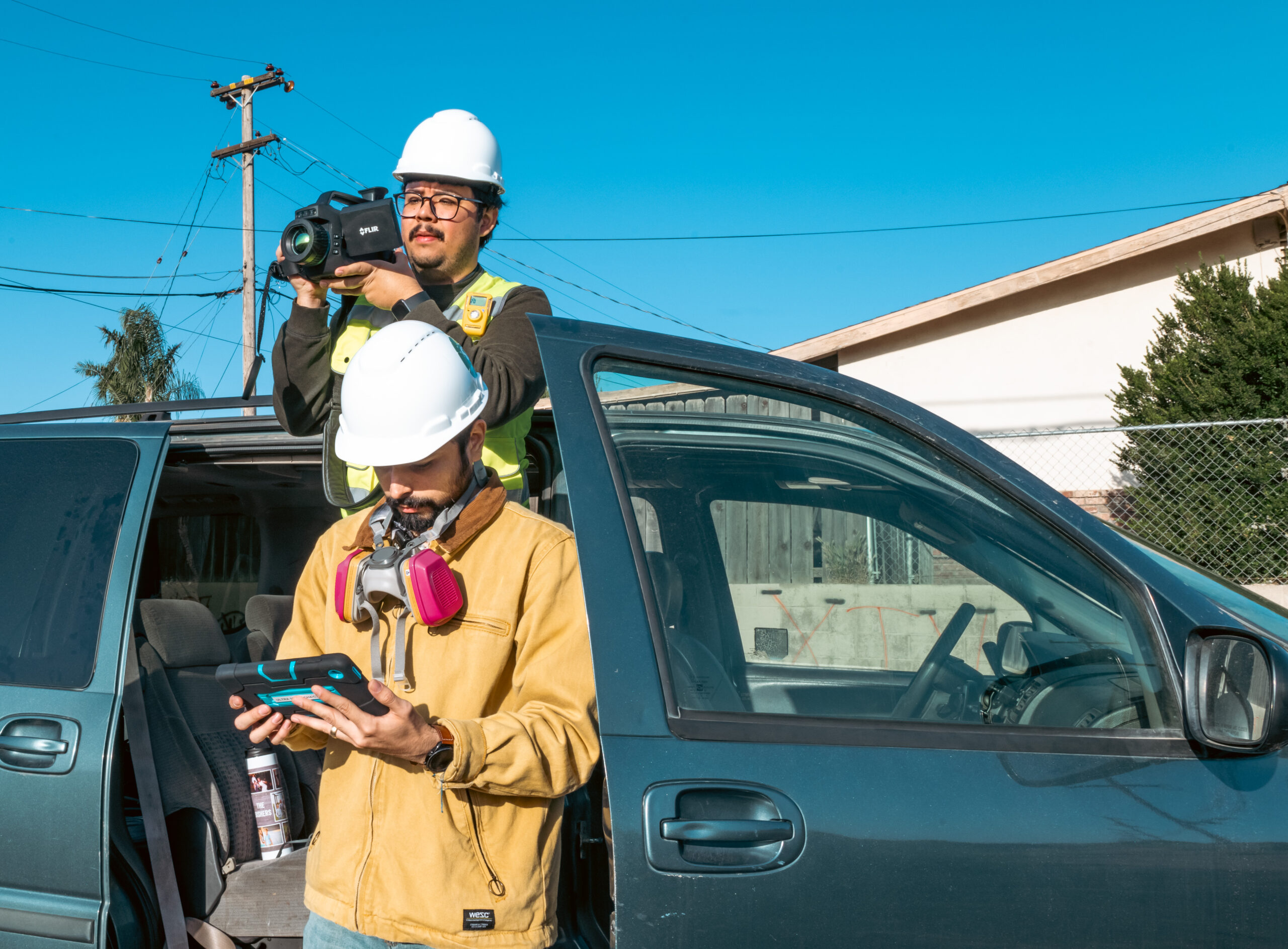 CCEJN staff use an instantaneous methane and ethane analyzer and a FLIR camera to detect emissions from nearby oil and gas equipment.