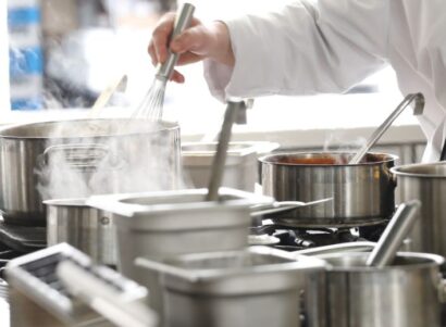 Image of a chef cooking in a kitchen.